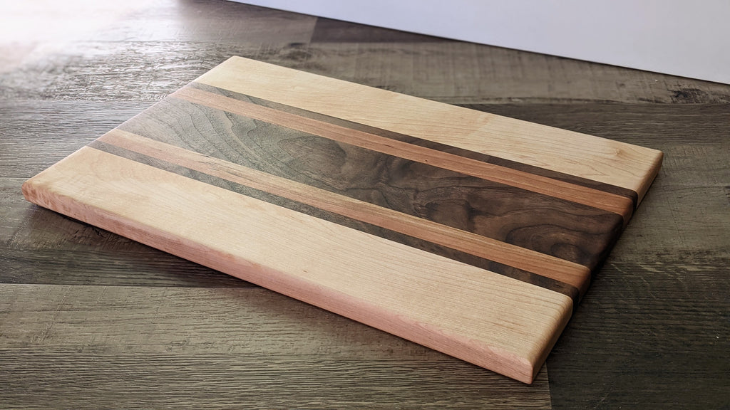 Maple with stripes of Walnut and Padauk Cutting Board – Campfire Woodworks